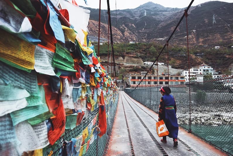 woman walking on bridge